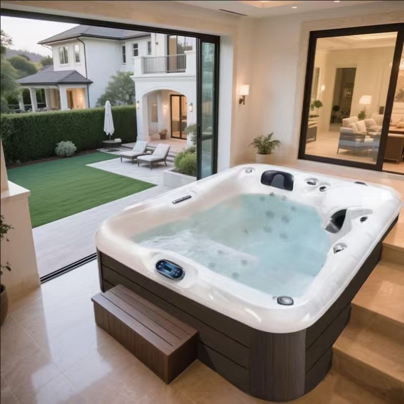 HydroSerene hot tub on a terrace beside glass doors