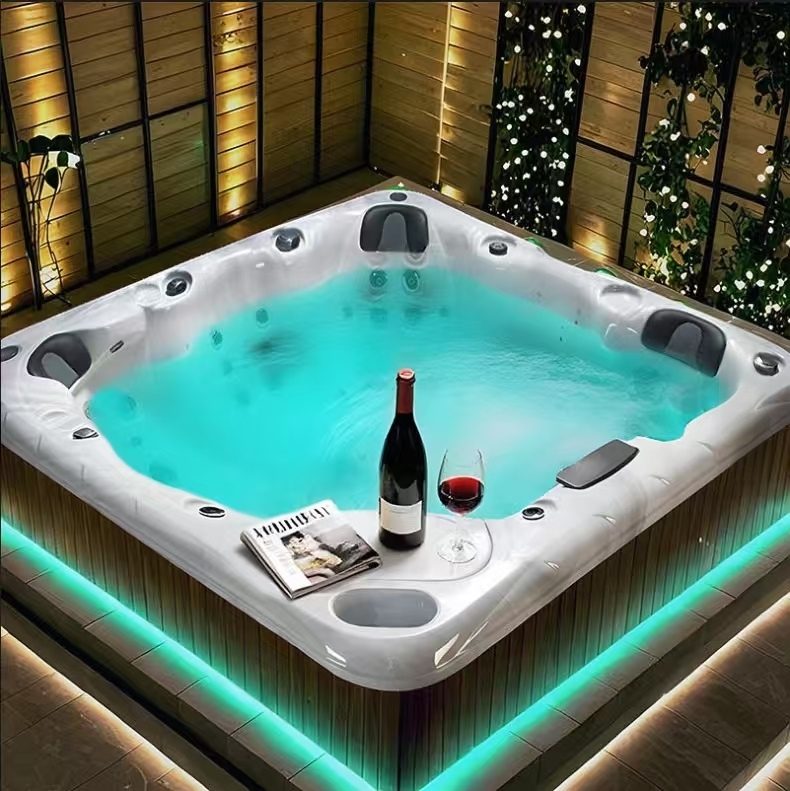 HydroSerene hot tub at night with LED skirt lighting